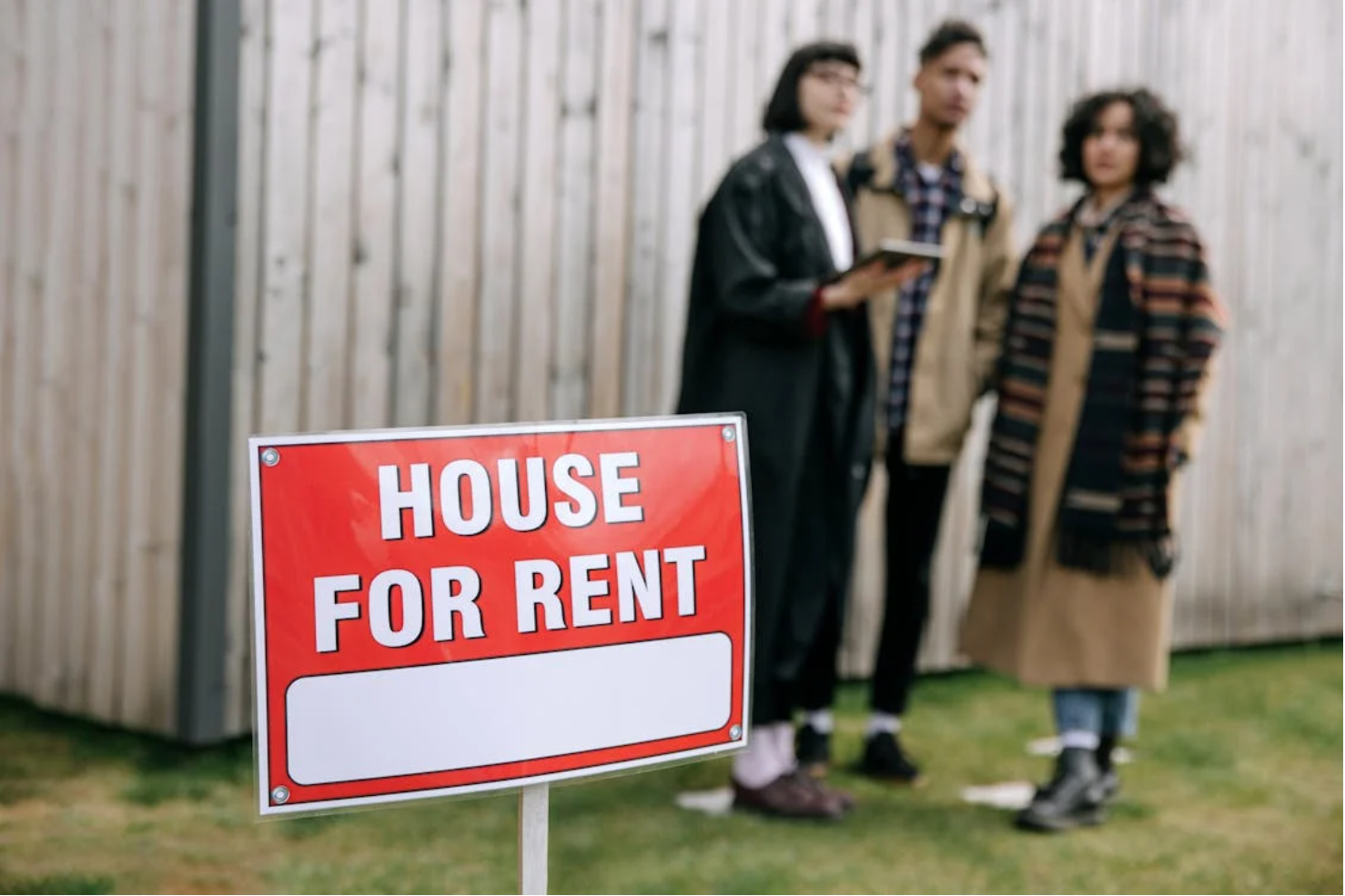 A house with a "For Rent" sign in the front yard, symbolizing a newly acquired rental property ready for tenants, reflecting fast real estate investment and rental income potential.
